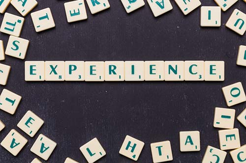 top view of experience text with scrabble letter