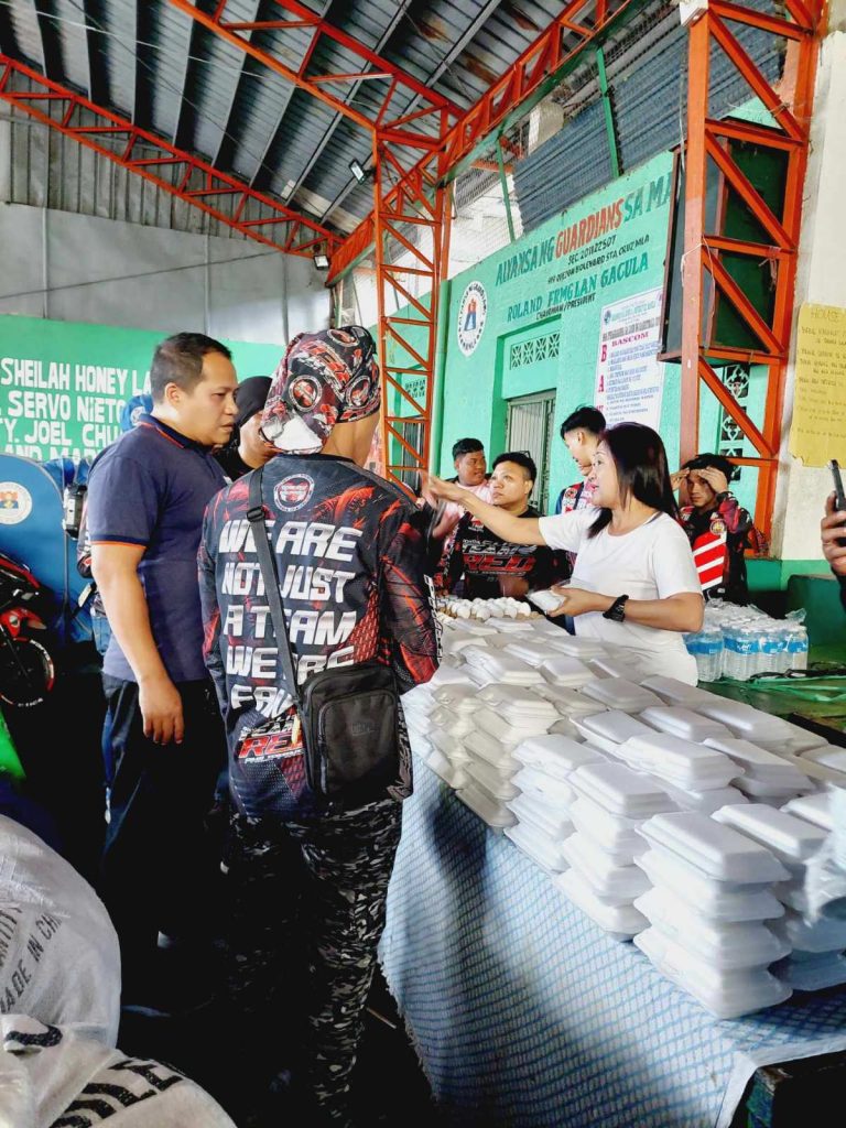 A group of people preparing the relief goods for fire victims