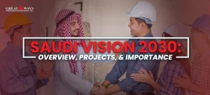 “A group of construction and industrial workers stand together, with a man in traditional Middle Eastern attire shaking hands with a worker wearing a hard hat. The image is overlaid with the text ‘Saudi Vision 2030: Overview, Projects, & Importance,’ along with the Greatways Manpower International, Inc. logo in the corner.